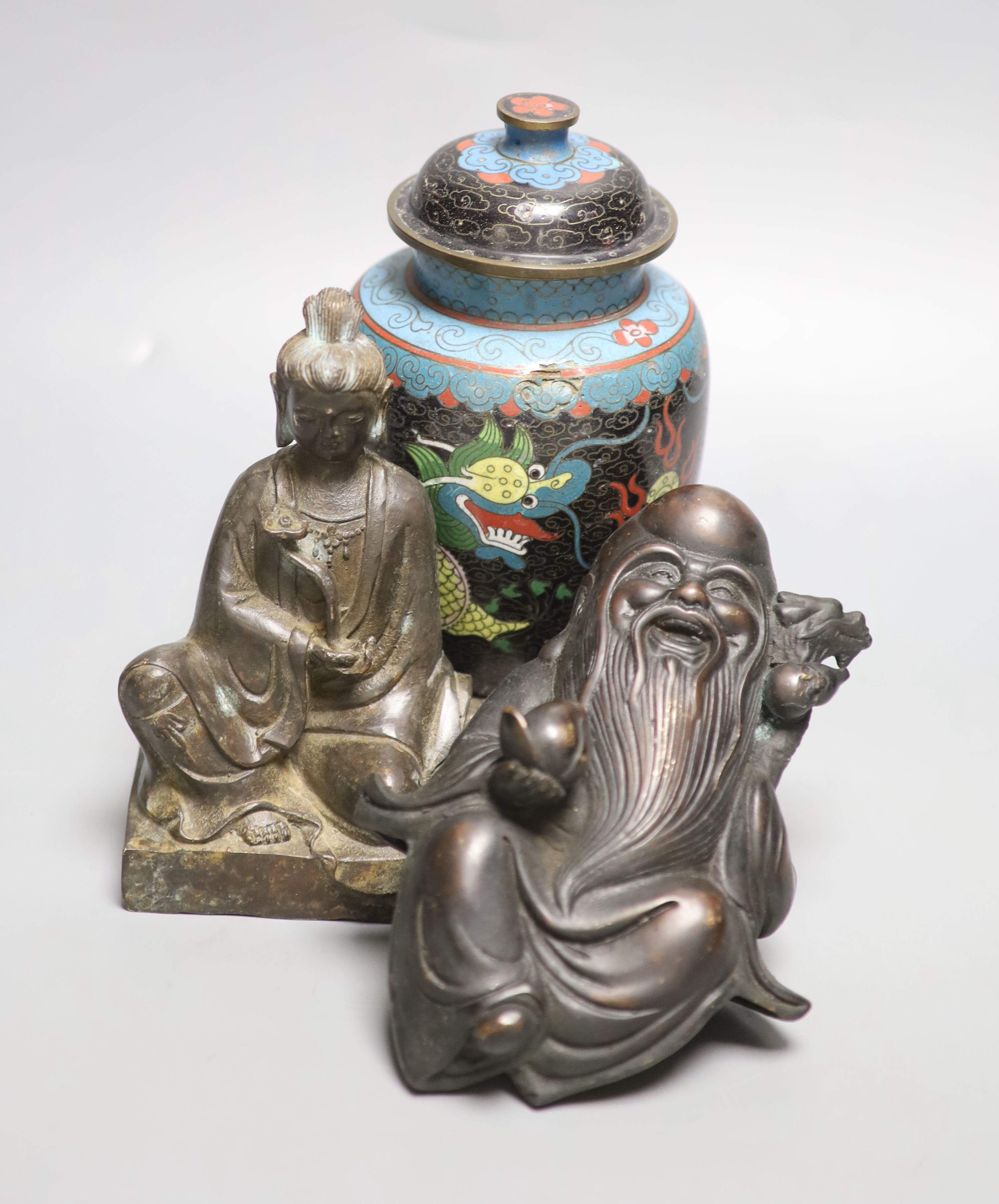 A Chinese bronze Buddha, height 17cm, a deity and cloisonne jar and cover
